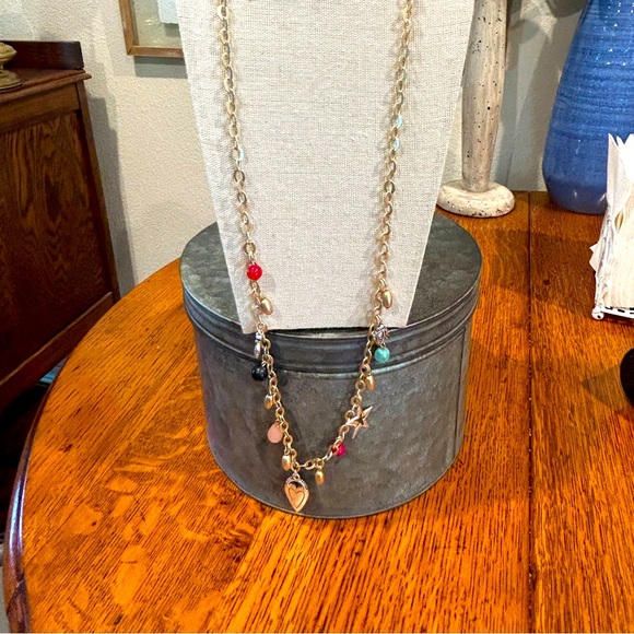 Chico’s 34 in charm necklace tag still attached. Charms include heart, star, etc - Picture 2 of 7